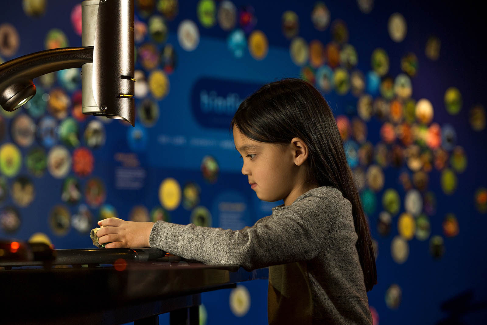 Child exploring with microscope