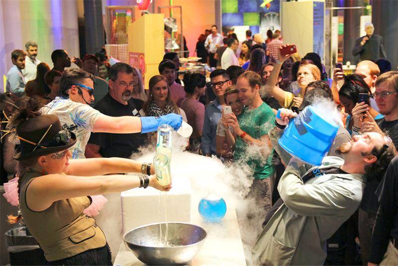 Adults watching a liquid nitrogen demonstration at a past Science on the Rocks night